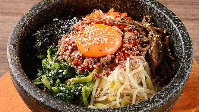 Stone-Grilled Bibimbap - Authentic bibimbap in a sizzling stone pot